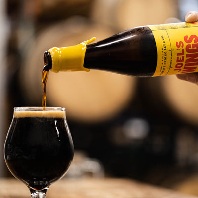 Joel’s Wings Imperial Stout 10.5% Aged in Whiskey Barrels for 14 months 